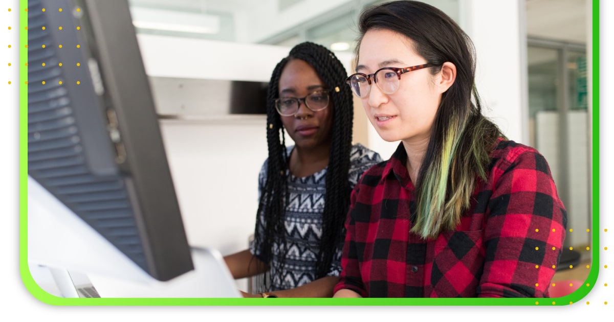 Two ladies looking a at computer