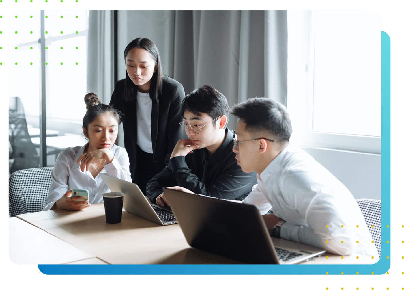 A group of young workers at a desk - LeanLaw