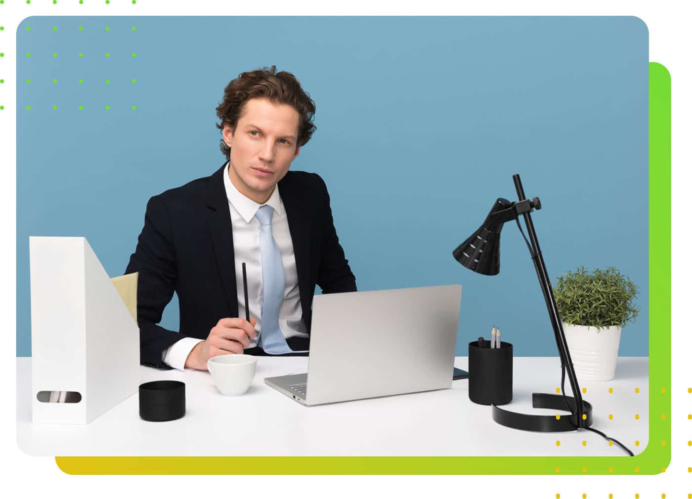 A man in suit in front of a laptop