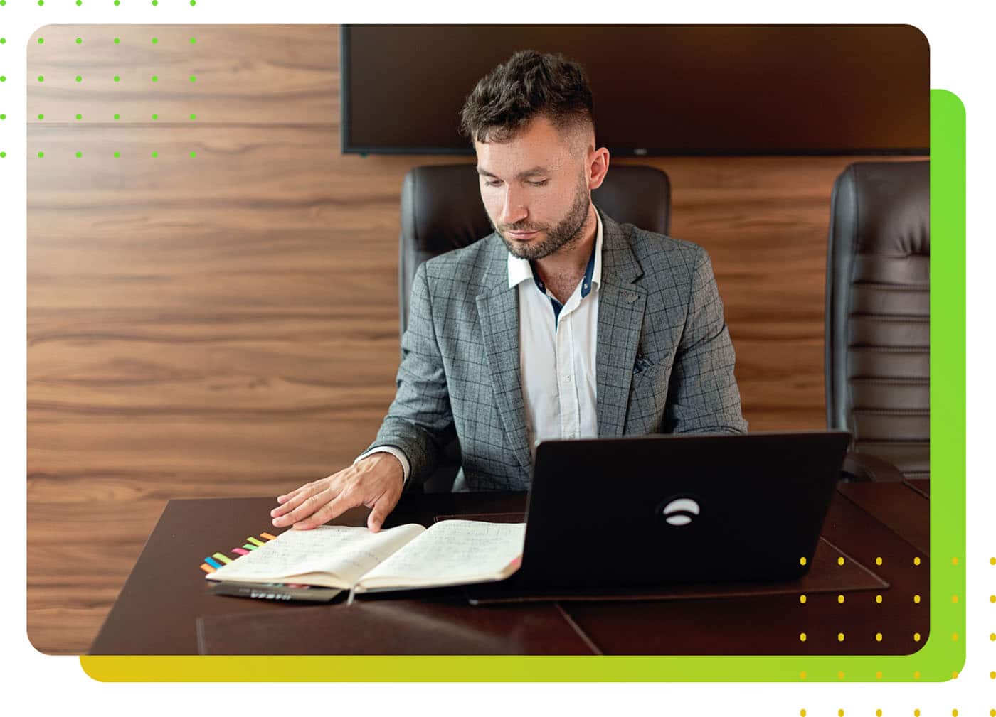 A man in suit sitting at a desk