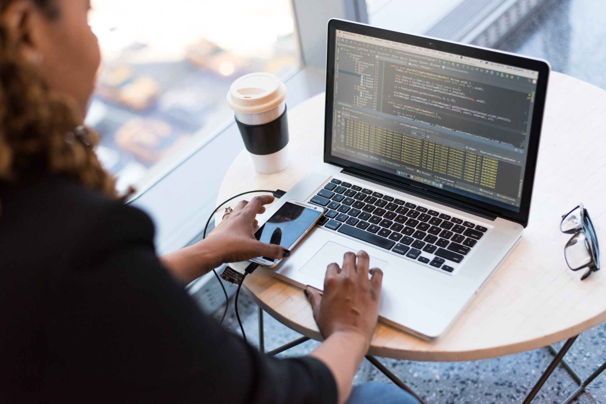 A woman operating a laptop